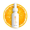 CBD Oil with orange fruit in background